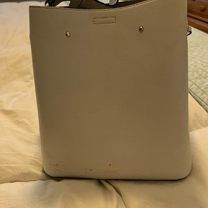 Kate spade bucket bag has a few nicks in leather as shown otherwise great bag